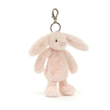 Bashful Blush Bunny Bag Charm hanging keychain featuring a soft pastel pink plush bunny with long ears, perfect for adding a cute touch to bags or backpacks.