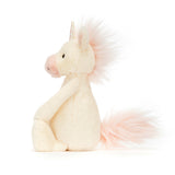 Side view of a soft plush Bashful Unicorn Small with a pale cream body, pink snout, and fluffy pink mane and tail, perfect as a toddler toy or kids birthday gift.