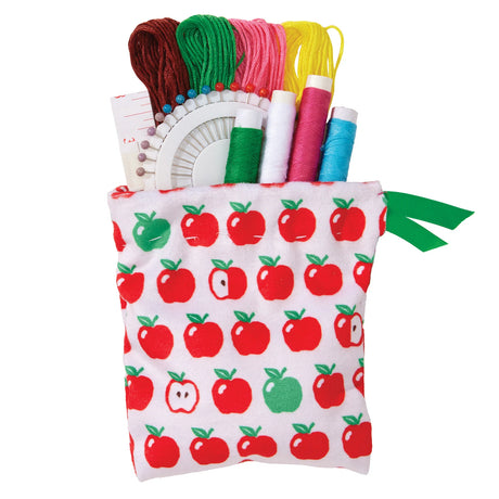 A fabric pouch with an apple print pattern, filled with colorful thread spools and a white circular sewing tool, on a plain white background.
