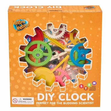 Heebie Jeebies DIY Clock toy set in its orange retail packaging, featuring colorful gears and clock parts visible through a die-cut window on the box.