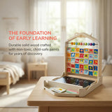 Children's educational Alphabet Learning Pack with letters and numbers on a wooden table in a room.