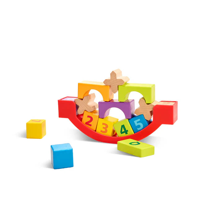 Colorful wooden Grow With Me Blocks with numbers and shapes on a white background