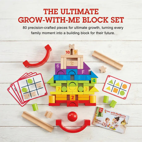 Grow-with-me block set with colorful blocks, cards, and a red handle on a white wooden surface.