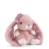 Pink plush Kanina - Flower Ears bunny with floral bow on a white background