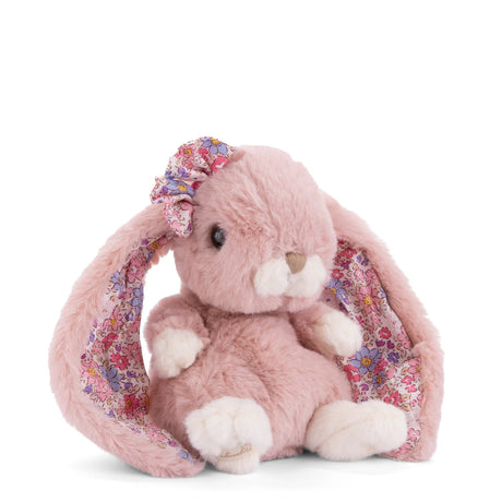 Pink plush Kanina - Flower Ears bunny with floral bow on a white background