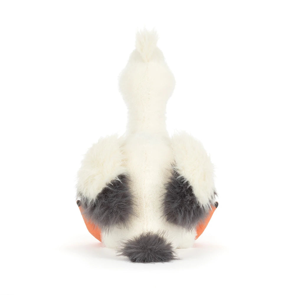 Back view of the Keli Pelican plush toy featuring soft white and gray body with bright orange feet, designed as a cuddly stuffed animal for kids.