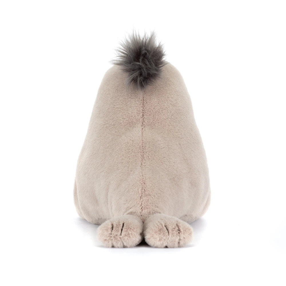 Roarwell Sea Lion plush toy shown from behind with soft beige fur and a tuft of darker fur on top, featuring small flipper-like feet resting on a white surface.