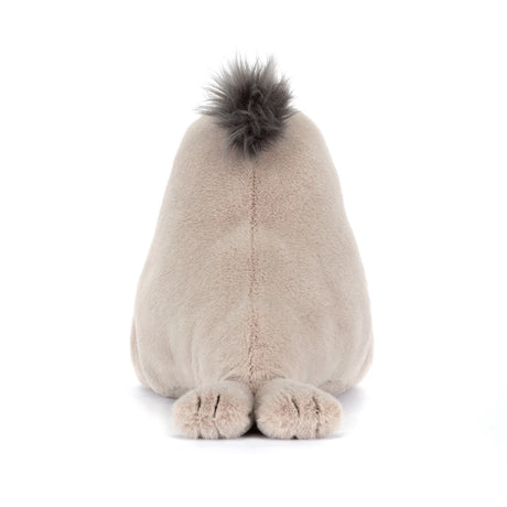 Roarwell Sea Lion plush toy shown from behind with soft beige fur and a tuft of darker fur on top, featuring small flipper-like feet resting on a white surface.