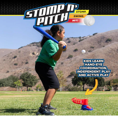 Child playing with 'Stomp n' Pitch' outdoor game equipment on a grassy field with mountains in the background.