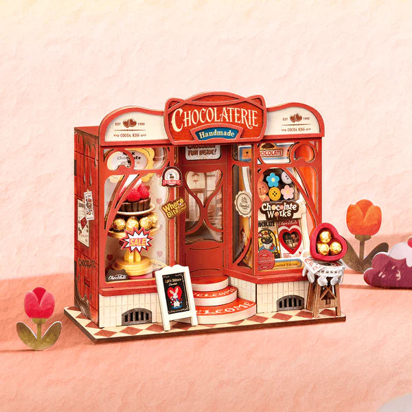 Sweet Chocolate Shop, Super Mini Houses with chocolate-themed products on a pink background
