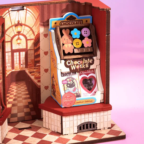 Sweet Chocolate Shop, Super Mini Houses with a pink bunny character inside, set against a warm interior background.