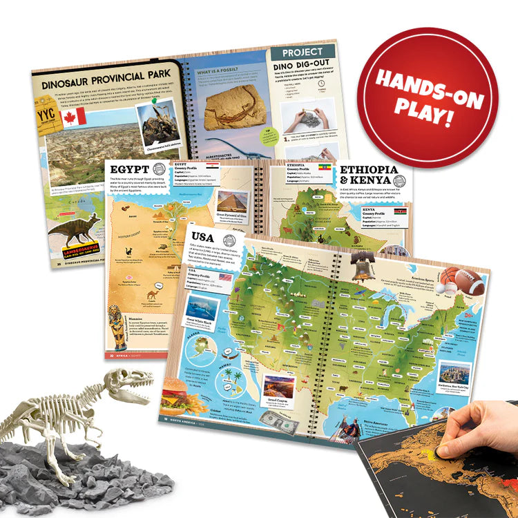 VR Atlas educational materials including maps and books on dinosaurs and geography with a hand holding a map.