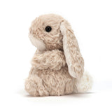 Side view of a plush Yummy Bunny Beige toy on a white background