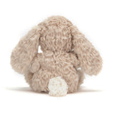 Rear view of a plush Yummy Bunny Beige toy on a white background