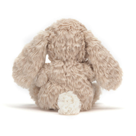 Rear view of a plush Yummy Bunny Beige toy on a white background