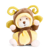 Plush toy bear in a yellow butterfly costume on a white background