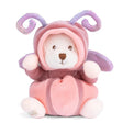 Plush toy bear in a pink butterfly costume with horns on a white background