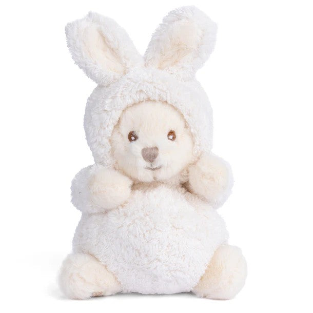 Plush toy bear dressed as a rabbit in a white outfit on a white background