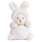 Plush toy bear dressed as a rabbit in a white outfit on a white background