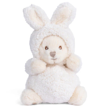 Plush toy bear dressed as a rabbit in a white outfit on a white background