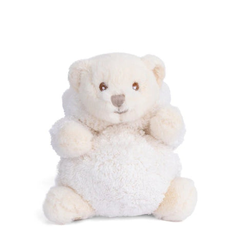 Plush toy bear dressed as a rabbit in a white outfit on a white background