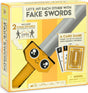 Box of a card game with foam swords and cards on a yellow background