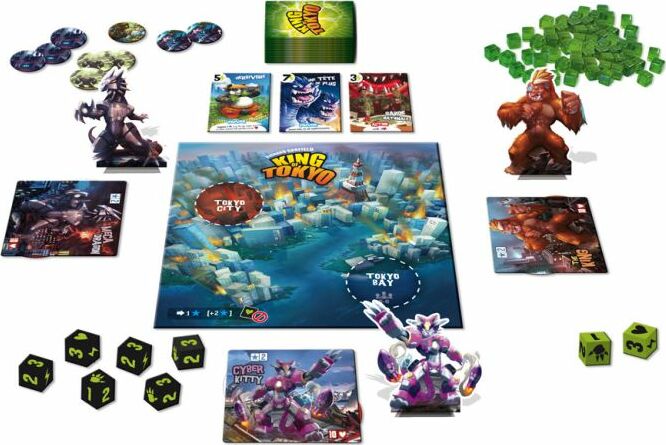 King of Tokyo 2nd Edition board game components including cards, dice, and game pieces on a white background