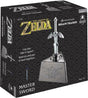 Box of 'The Legend of Zelda' Master Sword brain teaser puzzle with sword and Hyrule logo on black background.