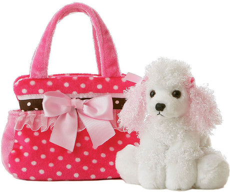 White poodle plush toy next to a pink polka dot handbag with a bow on a white background