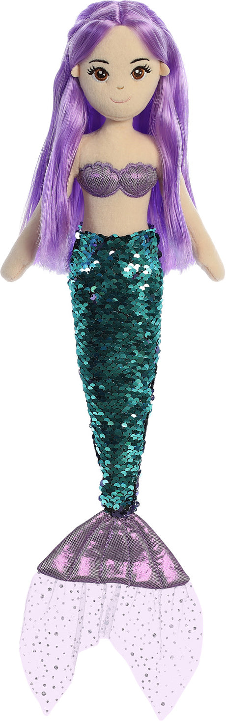 Mermaid doll with purple hair and sequin tail on a white background