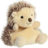 Plush toy hedgehog with a smiling face on a white background