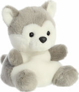 Plush toy dog with gray and white fur on a white background