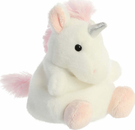 Plush unicorn toy with pink hair and horn on a white background