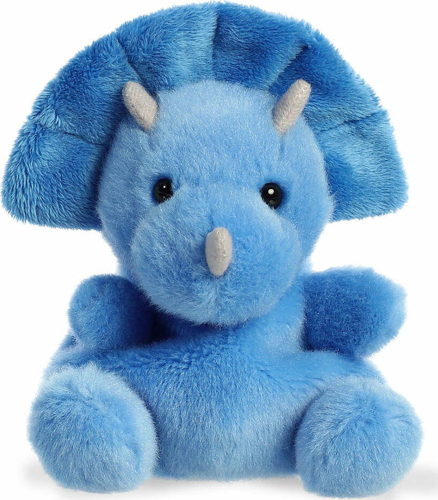 Blue plush dinosaur toy with a white background