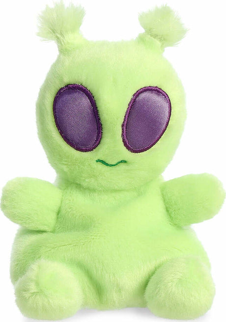 Green plush alien with purple eyes on a white background