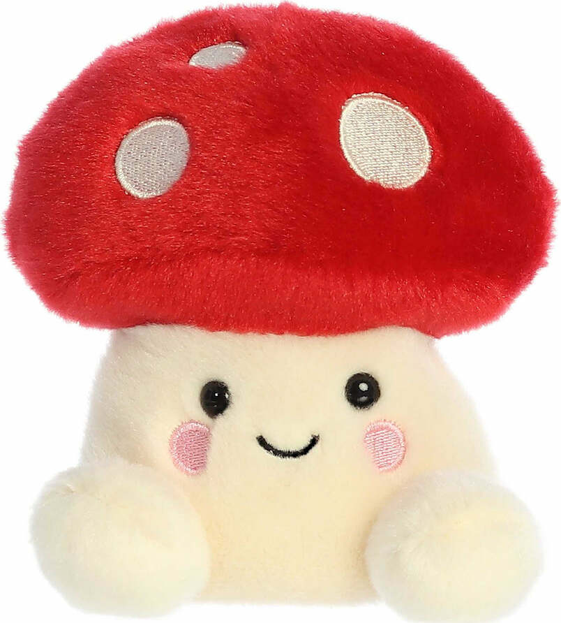 Plush toy with a red mushroom cap and smiling face on a white background