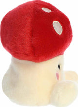 Plush toy red mushroom on a white background