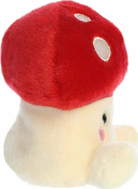 Plush toy red mushroom on a white background