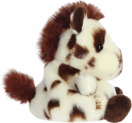 Plush toy horse with brown and white fur on a white background