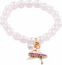Pearl bracelet with a ballerina charm on a white background