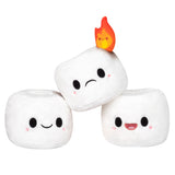 Three soft Mini Comfort Food Marshmallows plush toys with cute faces, one featuring a small flame on top, displayed on a white background.
