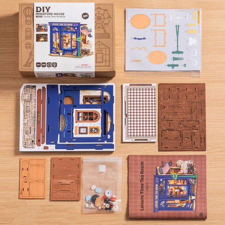 DIY Leisure Time Tea Room kit with components on a wooden surface