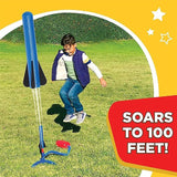Child playing with a Stomp Rocket® Jr. Rockets with 8 rockets toy that soars to 100 feet on a grassy field