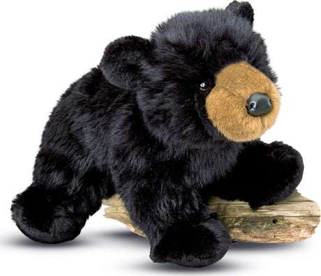 Plush Boulder Black Bear lying on a log on a white background