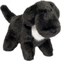 Plush toy Linda Lab Muzzle dog with black fur and a white chest on a white background