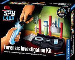 Spy Labs Forensic Investigation Kit packaging with hands holding tools and a tray of items.