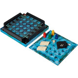 The Magic Labyrinth board game set shown on a white background, featuring a blue and black game board with a black game tray, translucent blue playmat, colored game pieces, dice, and a small black pouch.