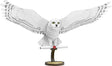 Metal model of Hedwig the owl on a white background