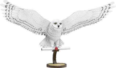 Metal model of Hedwig the owl on a white background