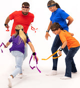 Four people participating in a Ribbon Ninja Game on a white background
